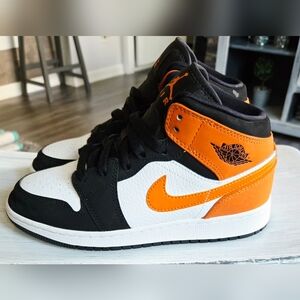 Jordan 1 Kids' Black, White, and Orange Sneakers